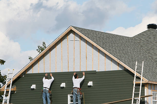 Professional Siding technician working in Westminster, MD